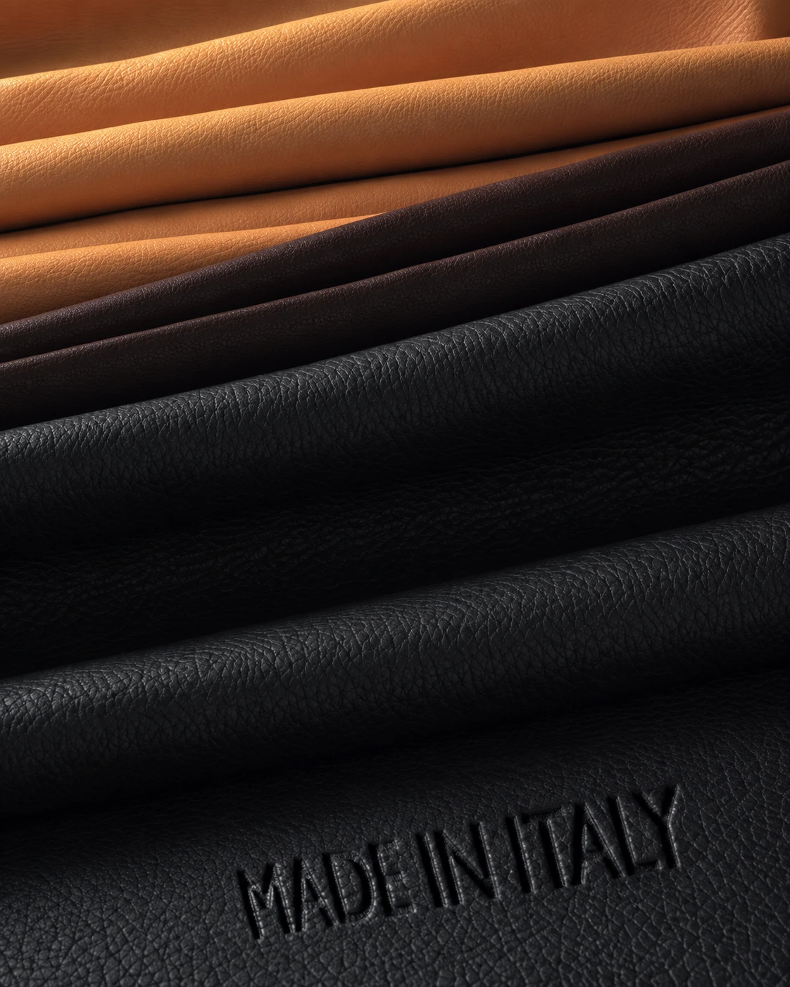 Layered hides in tan, dark brown and black, with Made in Italy embossed on the leather