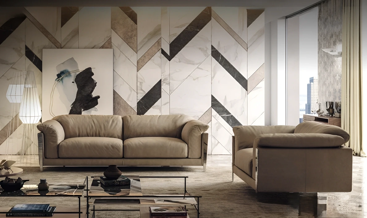 New Spark Brianform: divano e poltrona in pelle su basamento metallico
